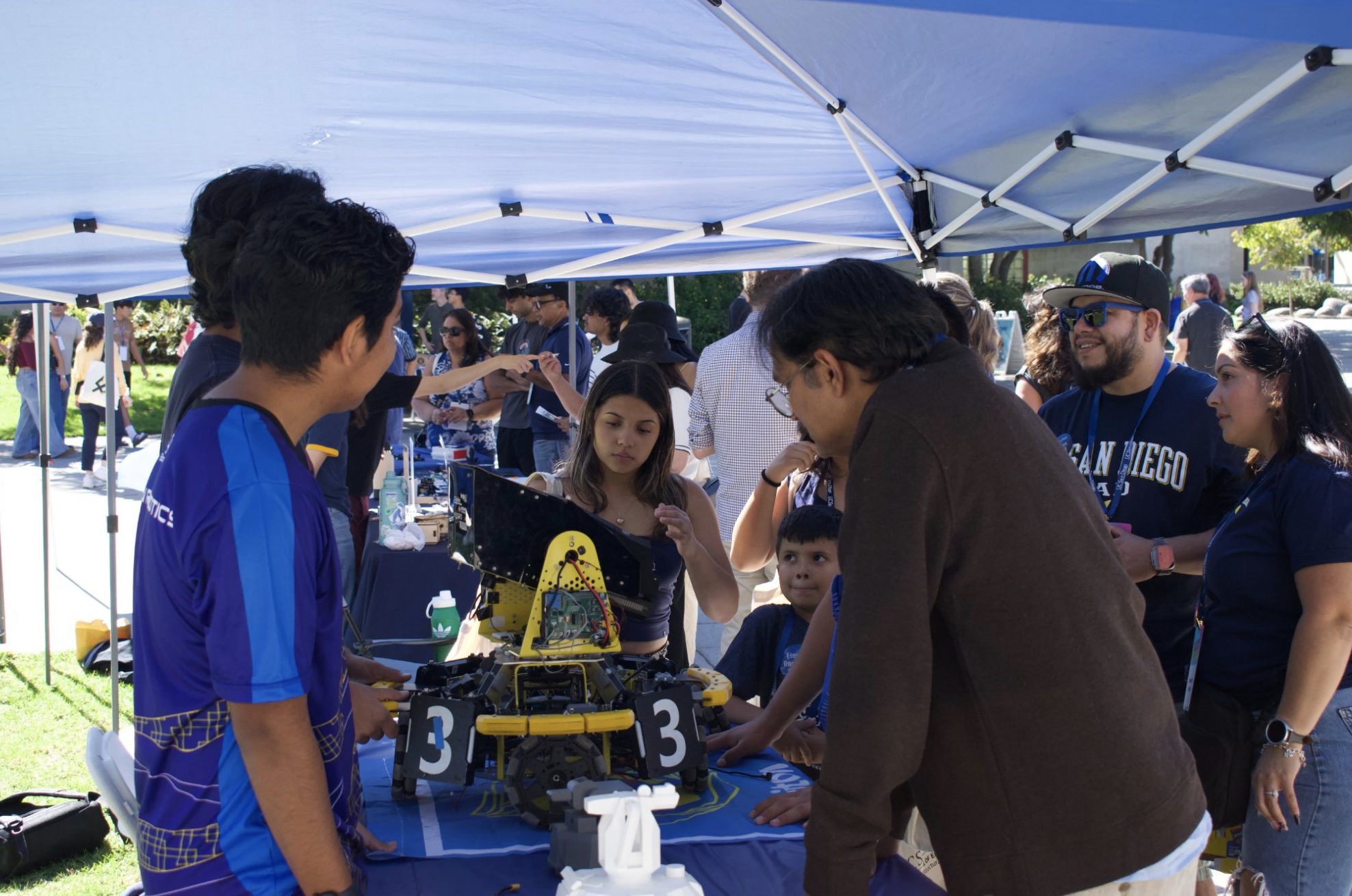 Triton Robotics demonstrating robots at UC San Diego Family Day