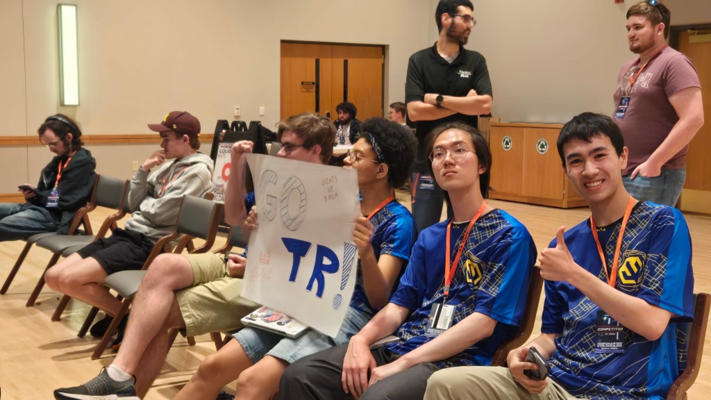 Triton Robotics members and robots at a competition